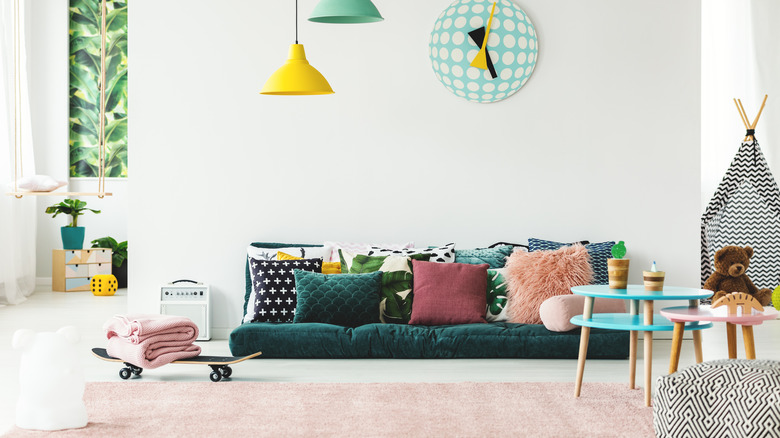 green sofa and pink rug