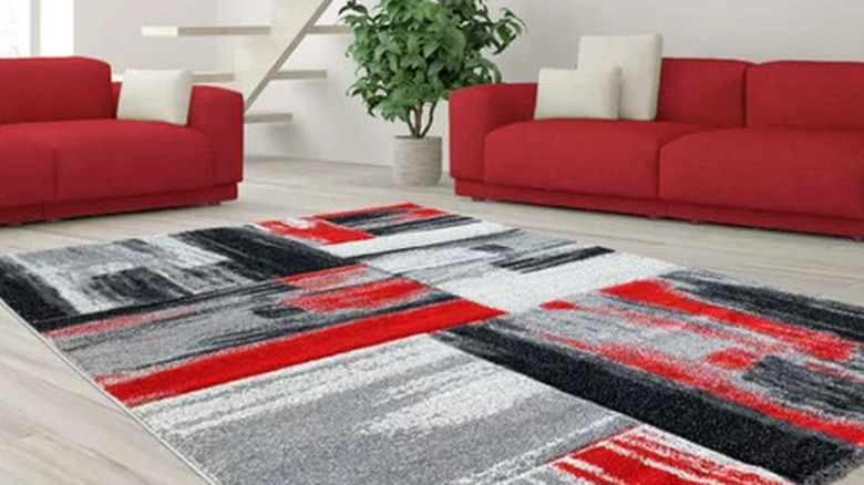 red sofa with monochrome rug