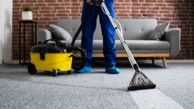 vacuum cleaning a carpet