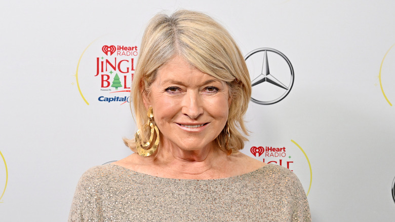 Martha Stewart wearing a sequined dress and smiling at red carpet event