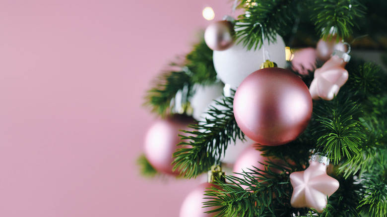 Pink ornaments on green tree