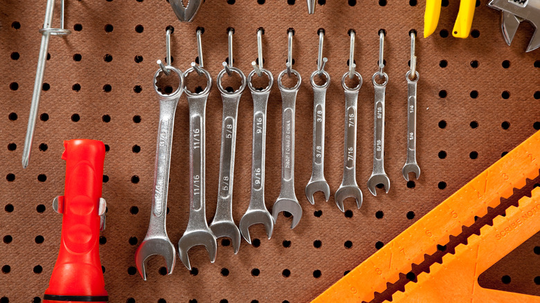 tools hanging on a pegboard