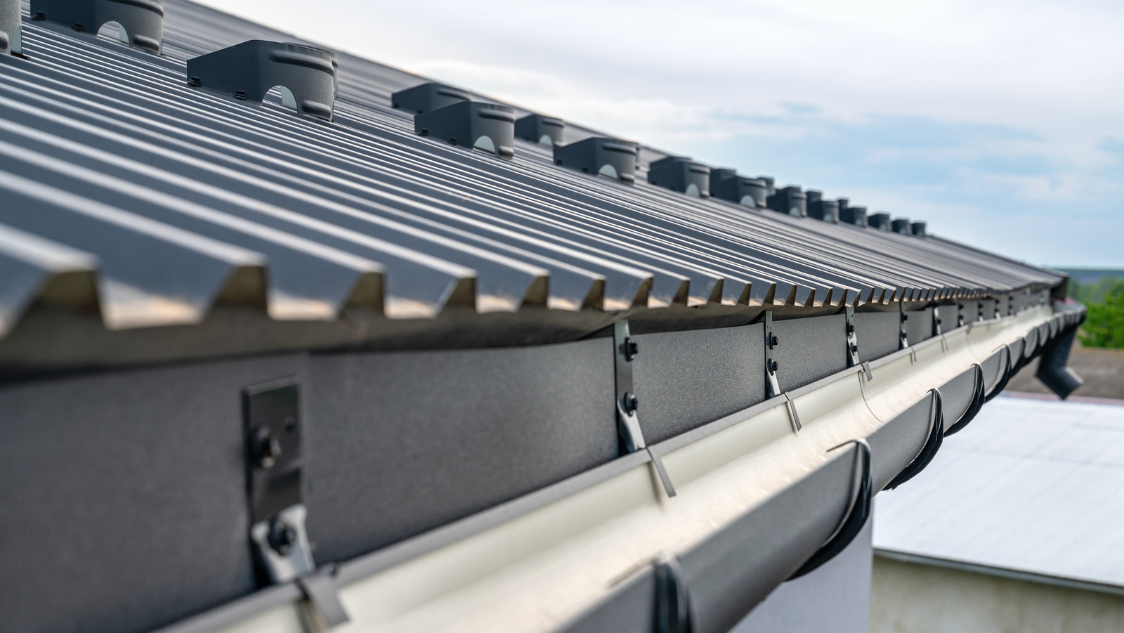 3 Ways To Keep Debris Out Of Your Gutters So You Don't Have To Clean Them