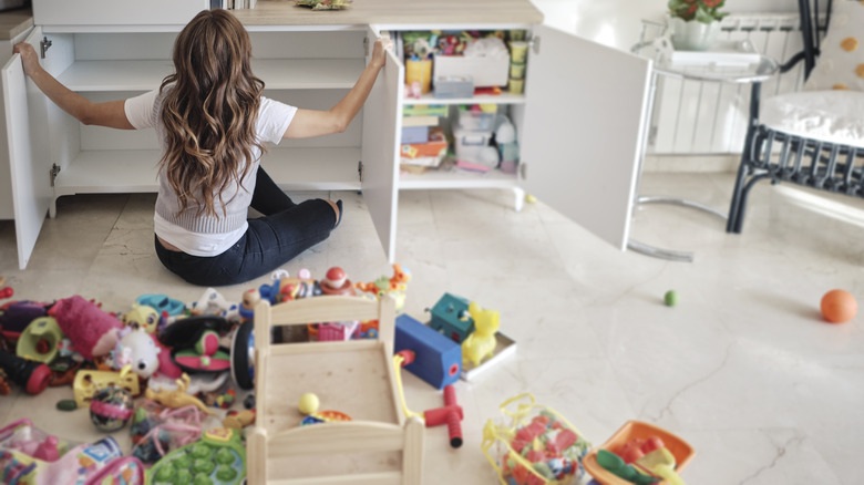 Woman organizing kids toys