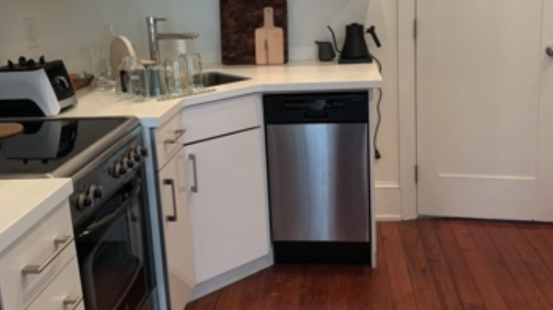 tiny white Ikea cabinet kitchen