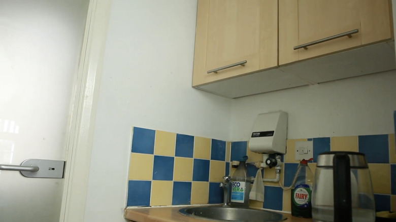 tiny kitchen with bright backsplash