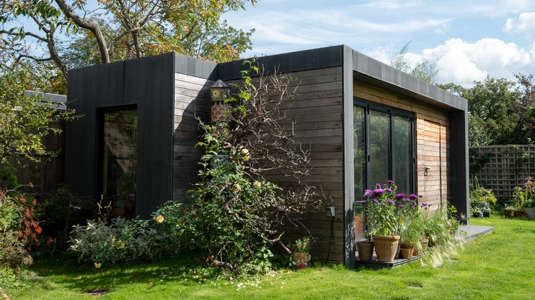 black and wood backyard office 