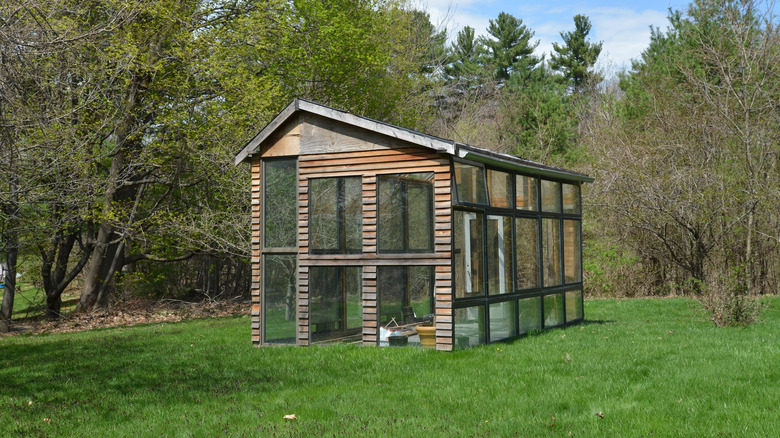 wooden greenhouse with large windows