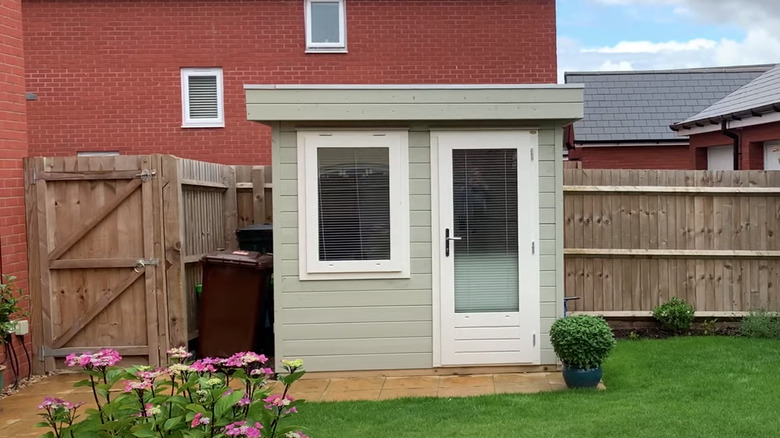 tiny light green backyard office