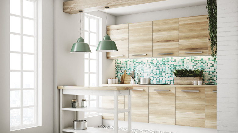 White kitchen green mosaic backsplash 