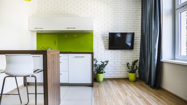 Lime green backsplash white kitchen