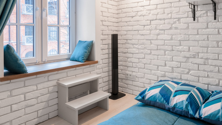 bright simple white brick bedroom