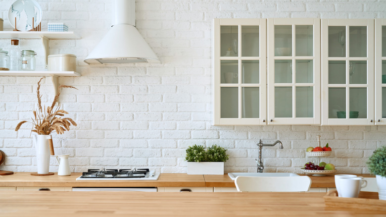 white-brick lined kitchen