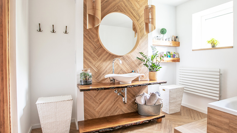 bathroom with a wood accent wall