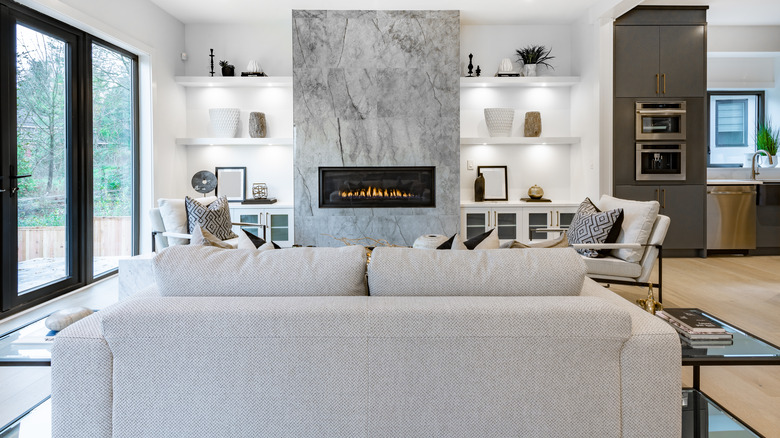 living room with a marble wall