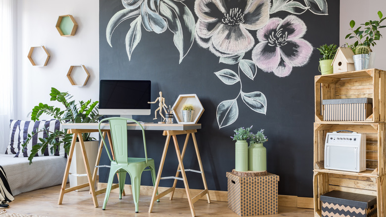 A chalkboard paint accent wall in a bedroom