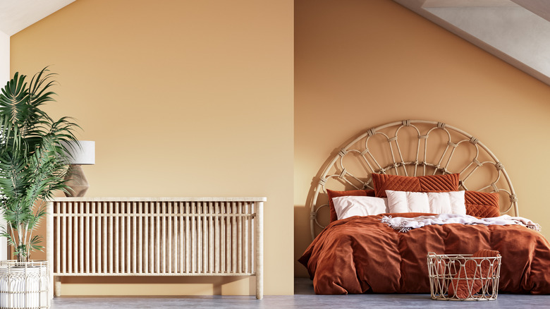 Simple tan bedroom with potted plant