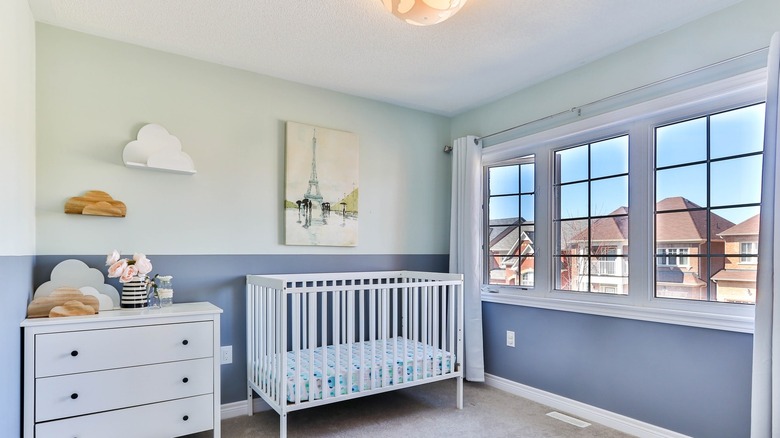 nursery with lower wall painted blue