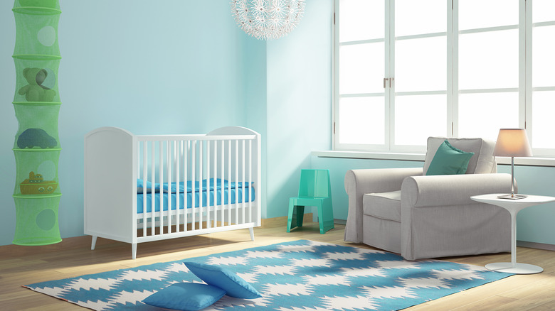 bright blue rug in baby room
