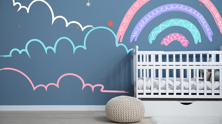 blue nursery with colorful mural