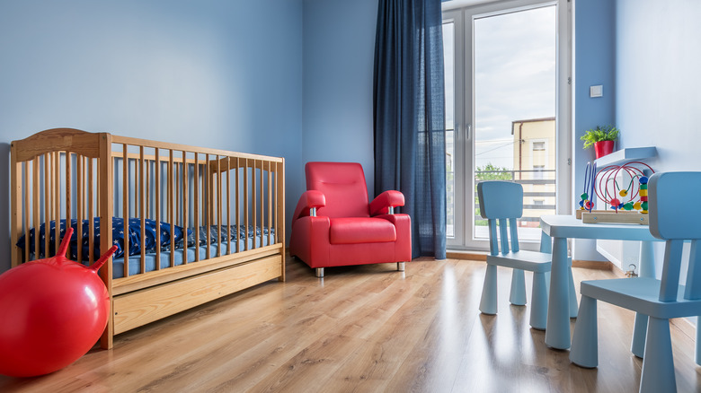 blue nursery accented with red decor