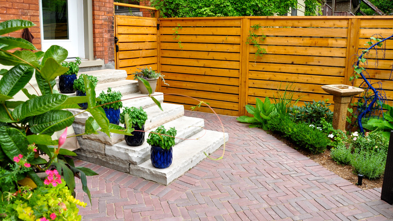 wooden wall and brick patio