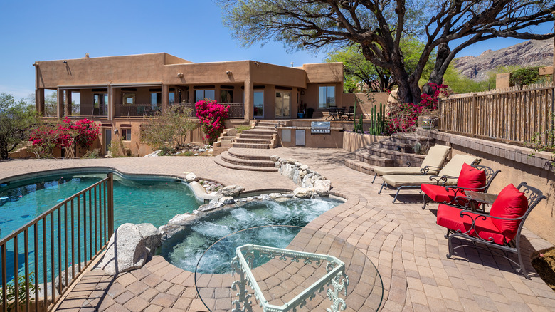 large brick patio with pool