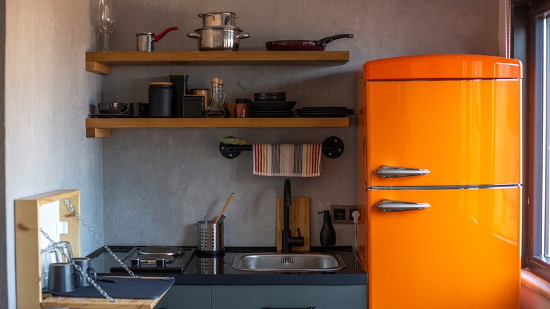 kitchen with orange retro fridge 