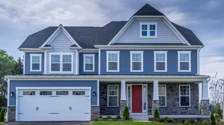 colonial style house with blue exterior