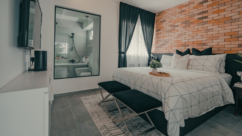 exposed brick wall bedroom 