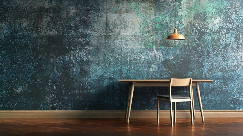 table against a blue-green wall