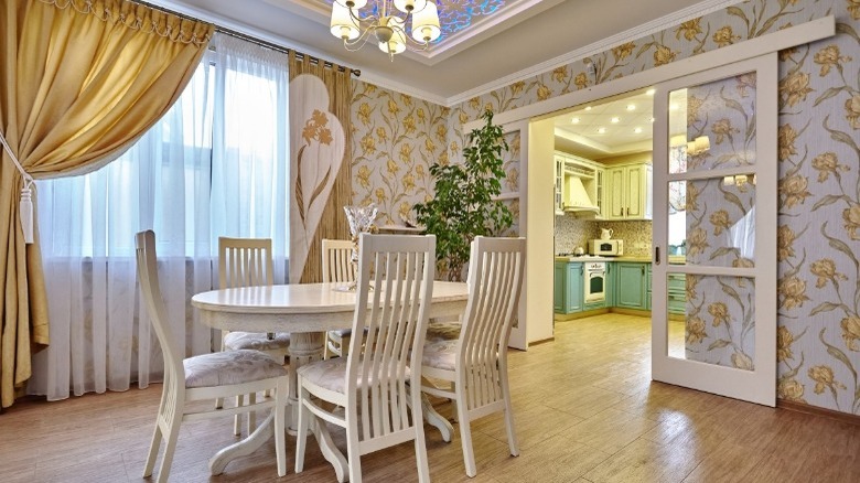 dining room with floral wallpaper