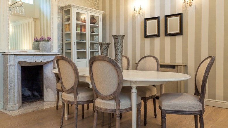 dining room with striped wallpaper