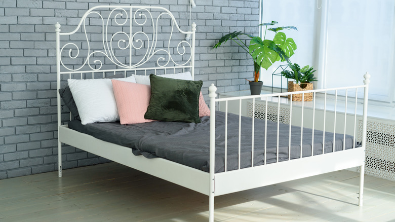 white metal railing bed 