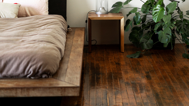 floating bed frame with dark wood