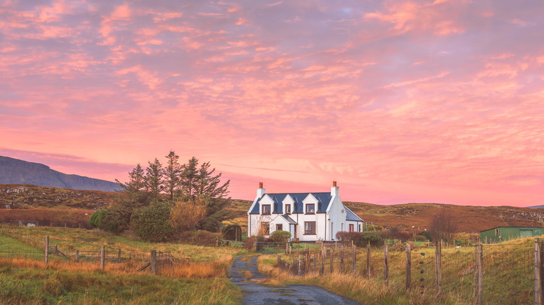 modern farmhouse with sunset background