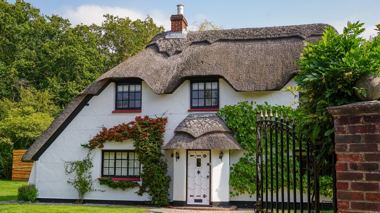 english cottage with thatched roof 