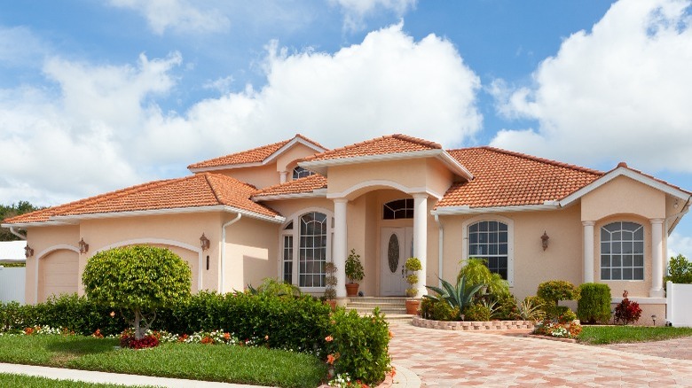 Cream house with brown roof