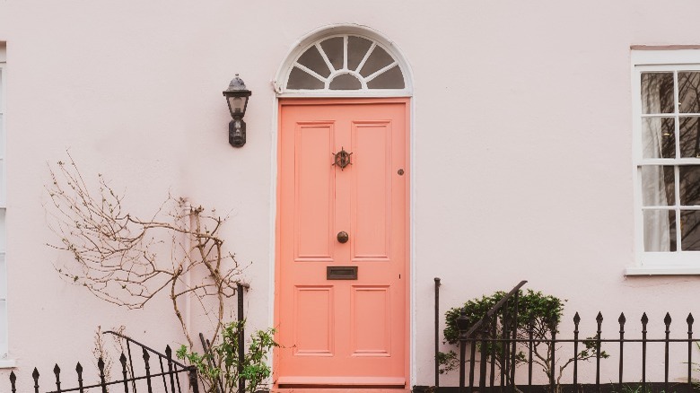 Peach door on pink house