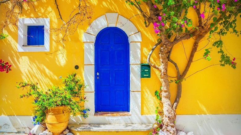 Yellow house with blue door