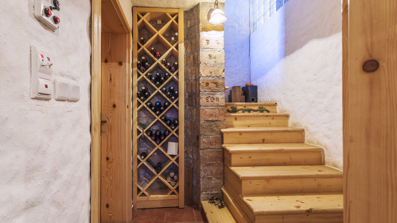 Wine cellar next to stairs 