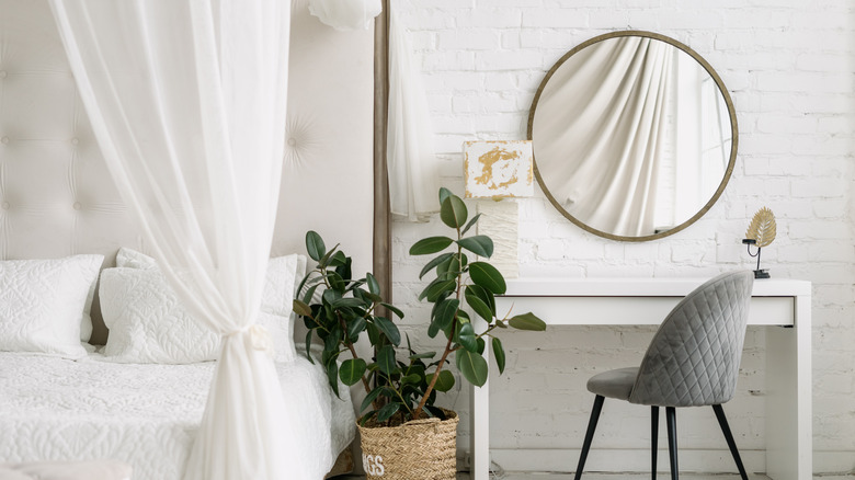 Clean white bedroom canopy bed