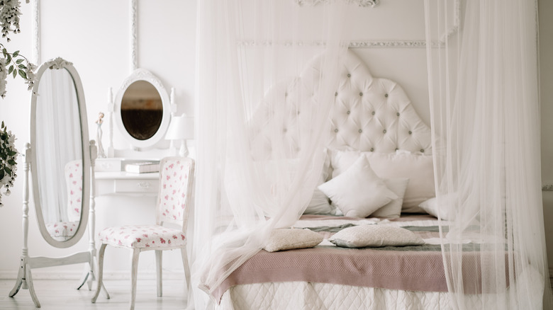 Clean white feminine bedroom