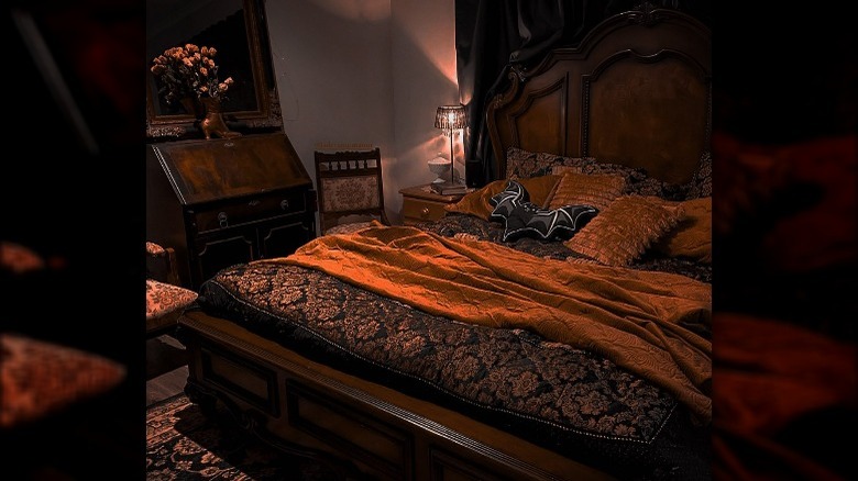 Orange blanket dark bedroom