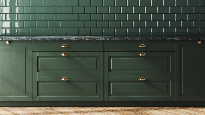 green cabinets with green tiles