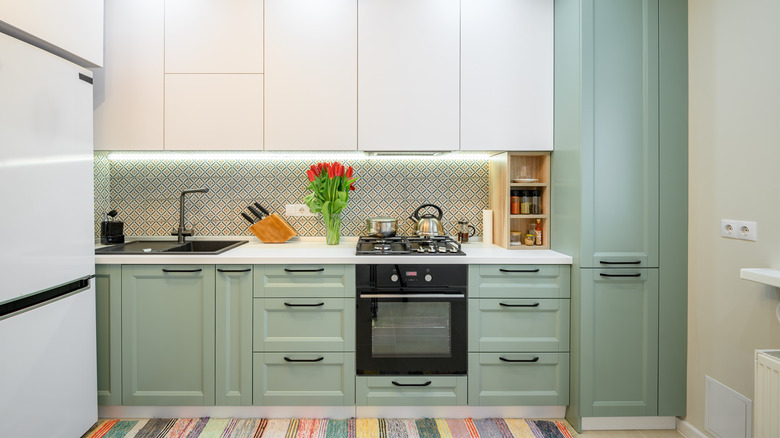 kitchen with mint green cabinets