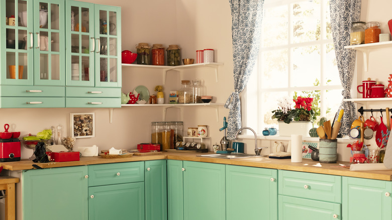 colorful kitchen with green cabinets