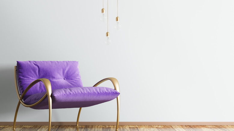 purple chair with brass accents