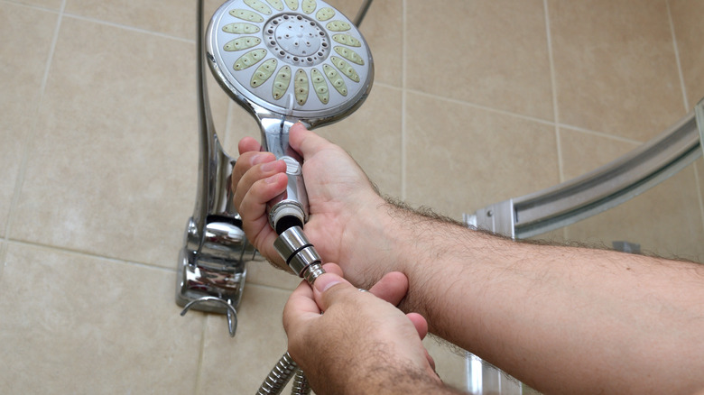 hands swapping showerhead