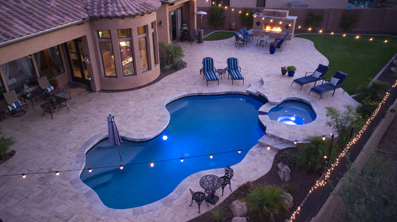a luxury backyard with pool 